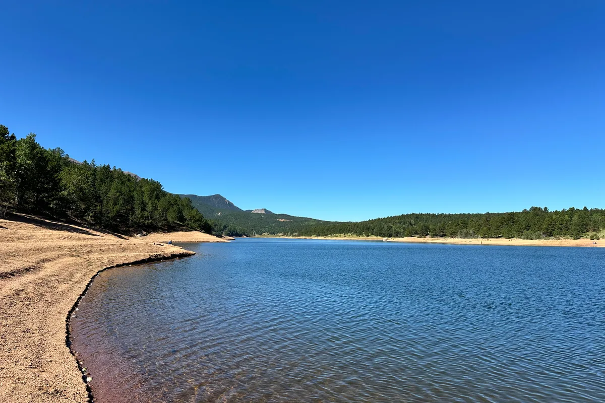 Rampart Reservoir shoreline with mountain panorama